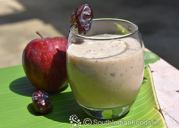 In a blender add apple , ice cubes