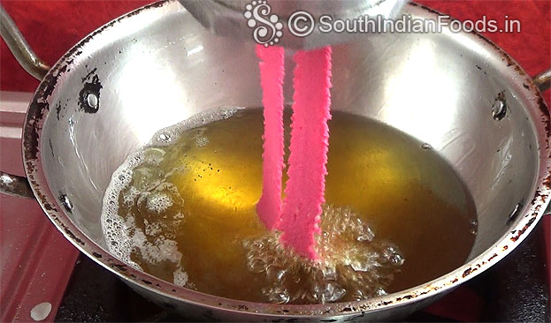 Squeeze over the hot oil deep fry till crisp