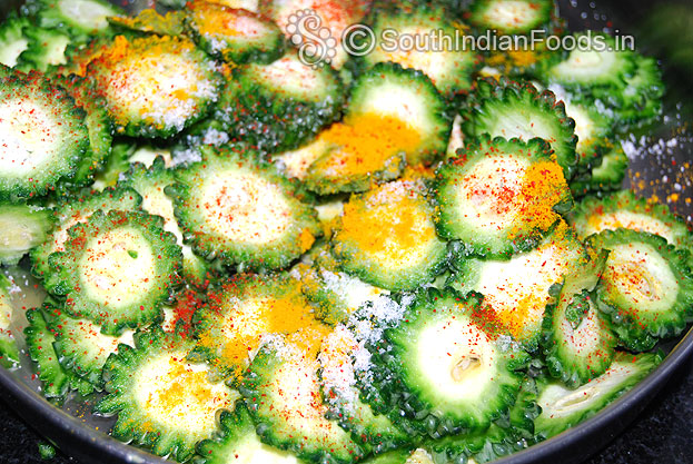 Cut into thine slices, Marinate with turmeric, red chilli powder & salt mix well
