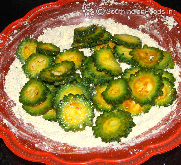 Add lemon marinated bittergourd, mix well