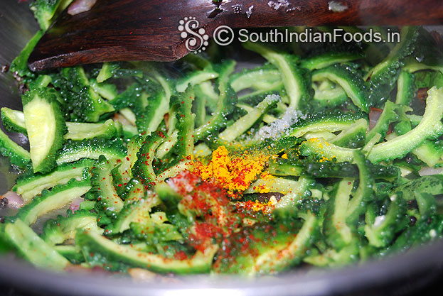 Add bitter gourd, turmeric, red chilli powder & salt mix well