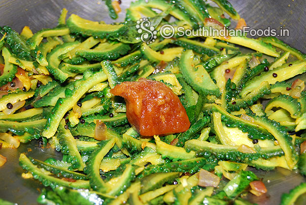 Add gooseberry size jaggery, mix well & let it melt