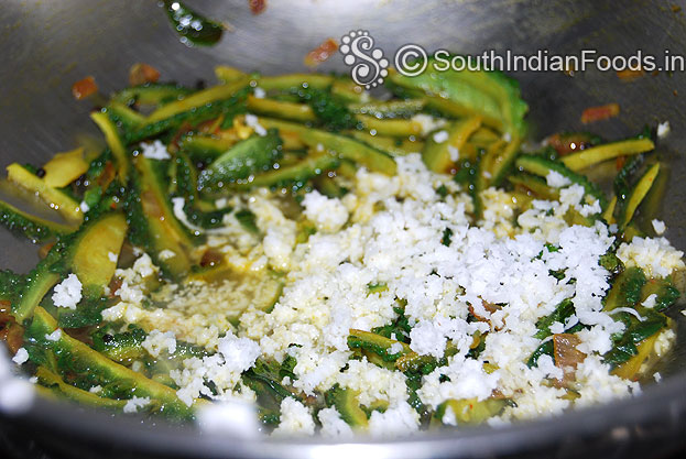 Add grated coconut mix well, cover lid, & cook till soft