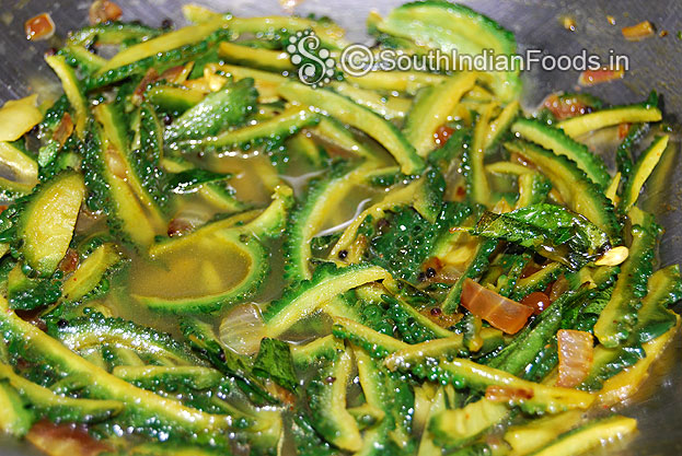 Then add water mix well, cover lid & cook for 2 min