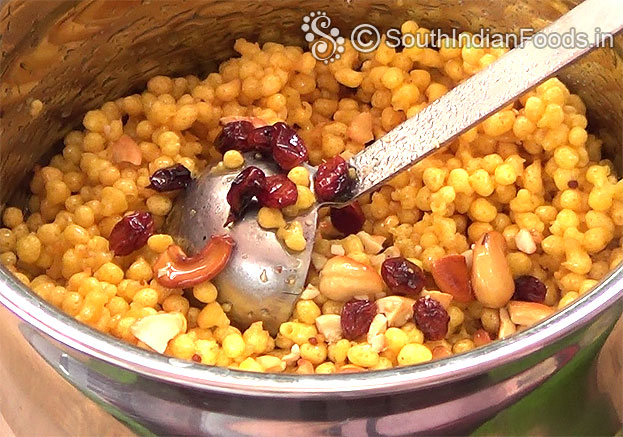 Add cloves & ghee roasted, chopped nuts, raisins