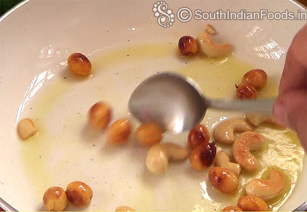 Heat ghee in a pan add raisins, cashews roast