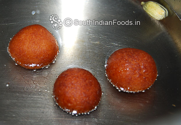Add fried balls into the sugar syrup