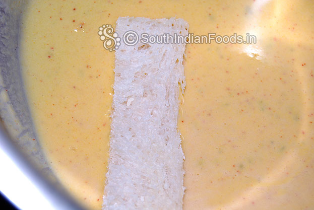 Dip bread slices in the gram flour mixture