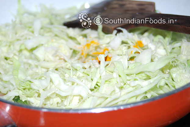 Add cabbage, turmeric powder, asafetida, & salt saute for a min.