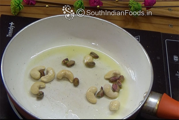 Heat 1 tbsp ghee roast cashews & pistachios