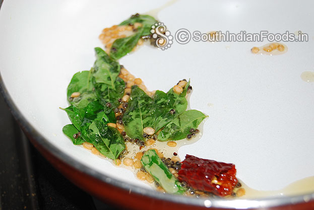 Add curry leaves, green chilli, dry red chilli