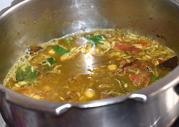 Add water, cover lid cook for 3 whistles