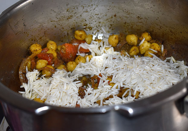 Add soaked basmathi rice and salt