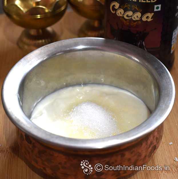In a bowl add fresh curd, sugar