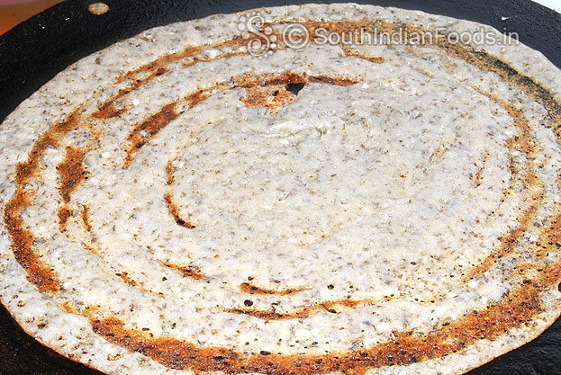 Heat iron dosa tawa. pour batter, spread & shape. Sprinkle oil