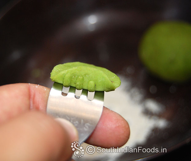 Place small ball on fork, press gently