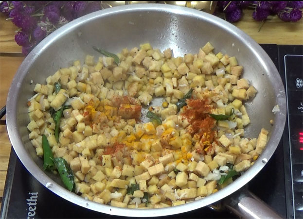 Add turmeric & red chilli powder, mix well