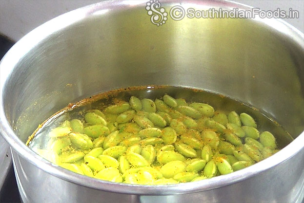 Boil field beans with turmeric & red chilli powder