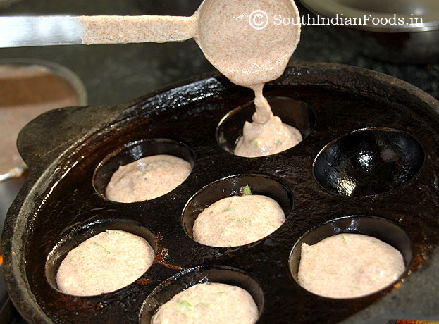 Filling 7 cavity with ragi paniyaram batter