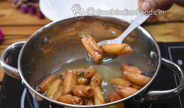 In a bowl add wheat flour, rava, ajwain, red chilli powder, turmeric powder & hot oil