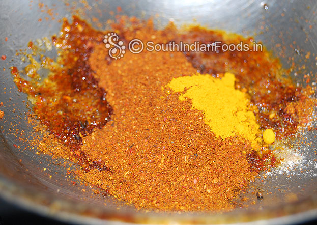 Add freshly ground powder, turmeric powder mix well