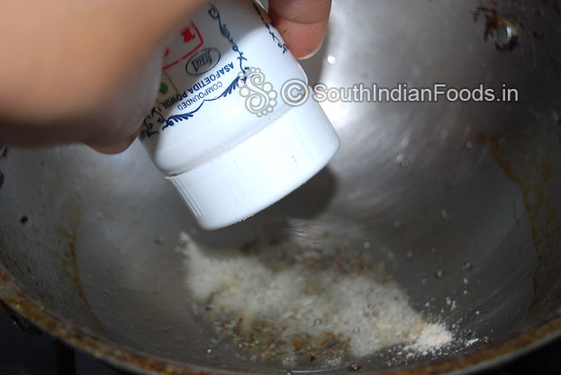 Heat another pan, add gingelly oil then add asafetida