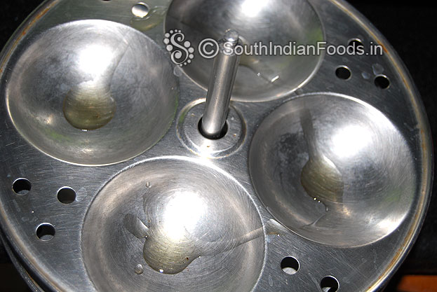 Grease idli plates with ginelly oil