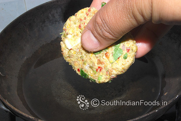 Heat oil put shaped vada