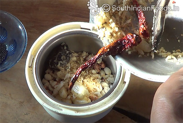 Add roasted ingredients, grind with 1/2 glass of water
