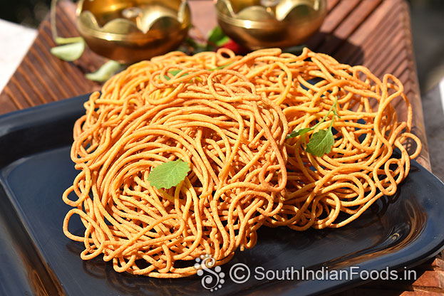 In a bowl add gram flour, rice flour, turmeric powder & salt