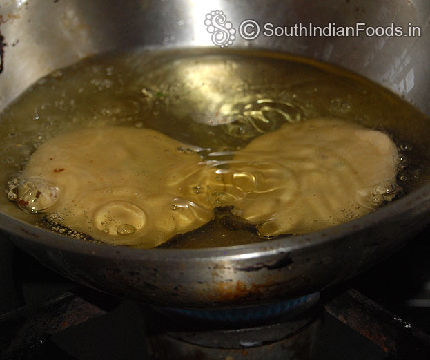 Heat oil in a pan, put raw kachori, deep fry on low to medium hot oil