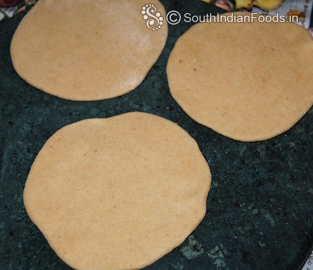 Sprinkle flour roll out into thick poori, grease with 1 tbsp of ghee