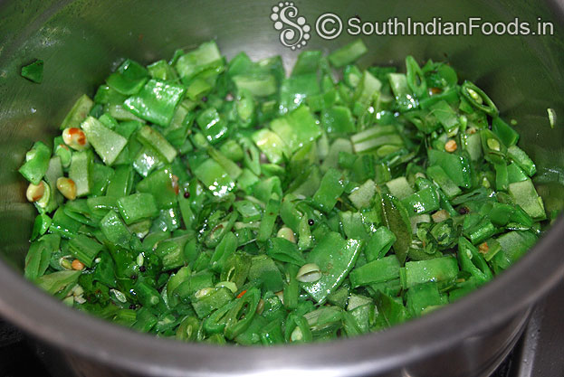 Heat 2 tbsp oil in a pan add mustard seeds, chana dal, urad dal, asafoetida, curry leaves, dry red chilli , fry then add broad beans saute for 3 min