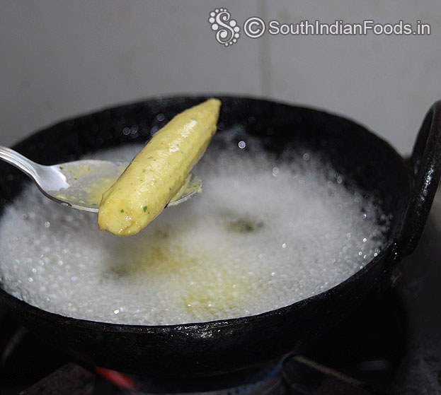 Heat enough oil, add baby corn, deep fry till crisp and golden brown