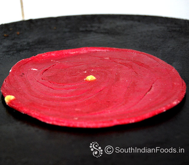 Heat iron dosa tawa, place raw paratha, add 1 tbsp ghee