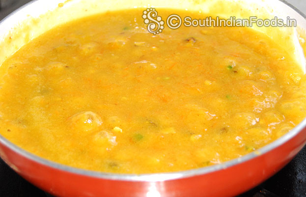 Stir besan carrot mixture on medium flame