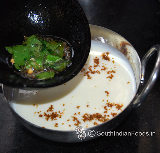 In a bowl add fresh curd, roasted cumin powder, salt mix well, add seasoned ingredients