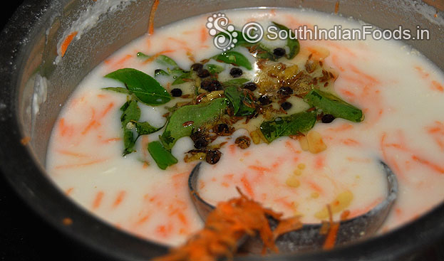 Add seasoned ingredients into carrot rava dosa batter