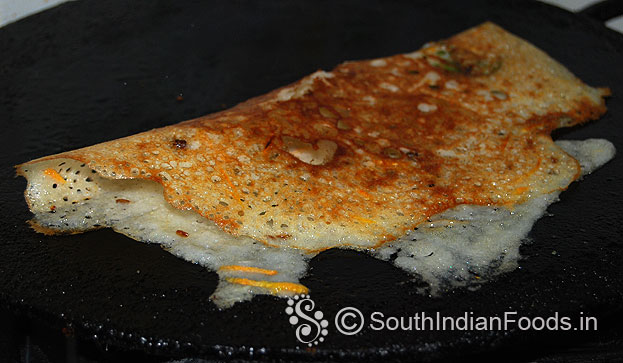 Crispy carrot rava dosa is ready, fold and serve hot