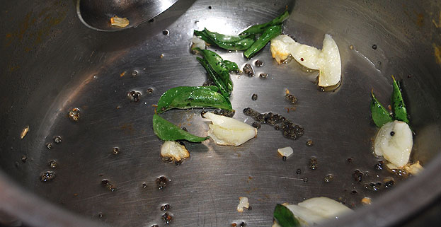 Heat oil, add mustard seeds, garlic, curry leaves