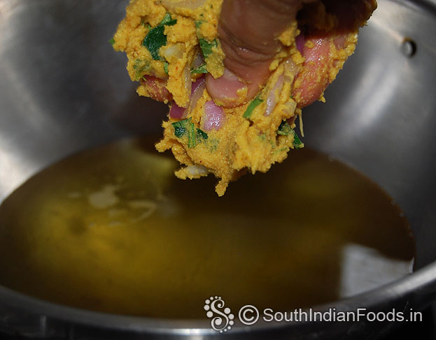 Sprinkle pakoda mixture over the hot oil