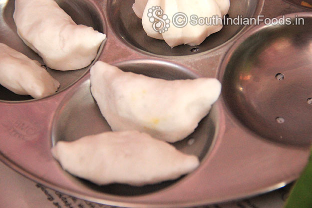 Place half circle kozhukattai in the same idli cooker steam it