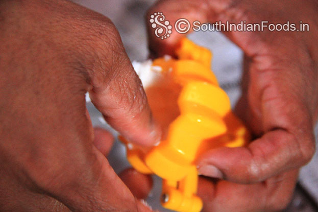 Place lemon size ball, place it in a modak mould & evenly spread