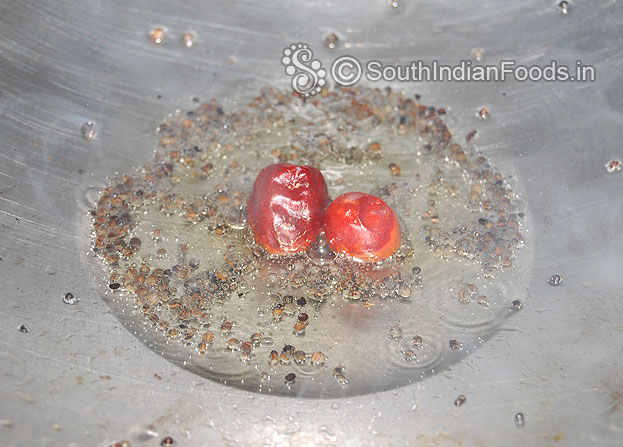 Heat oil in a pan, add mustard, let its splutter, then add dry red chilli
