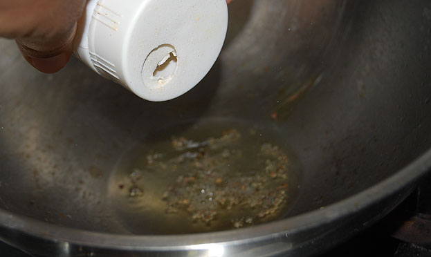 Heat sesame oil add mustard seeds let it splutter then add asafetida