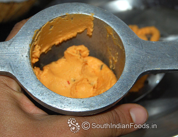 Put 1 handful dough in murukku kuzhal
