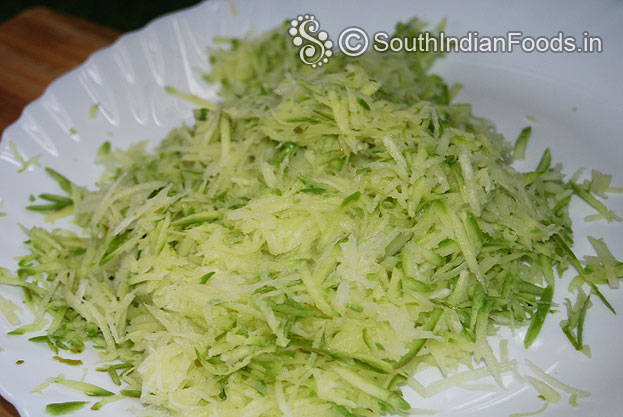 Grate raw mango mangai