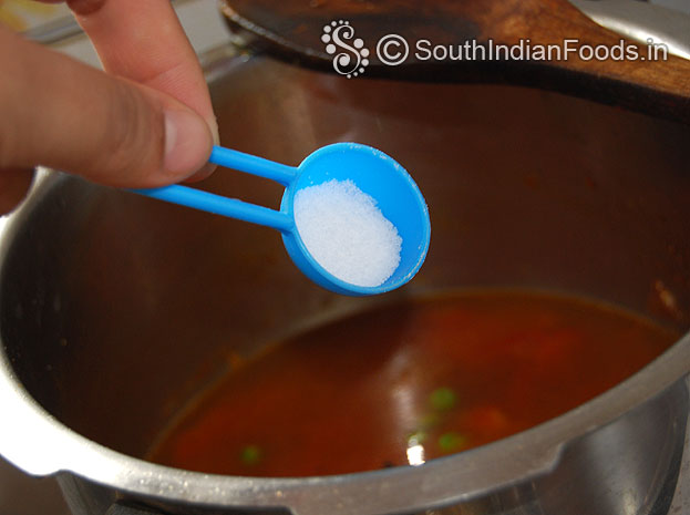 Heat pressure cooker with oil then add onion garlic