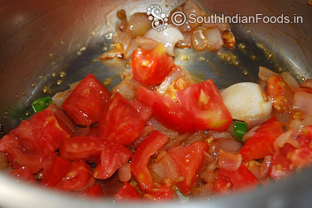 Heat pressure cooker with oil then add onion garlic