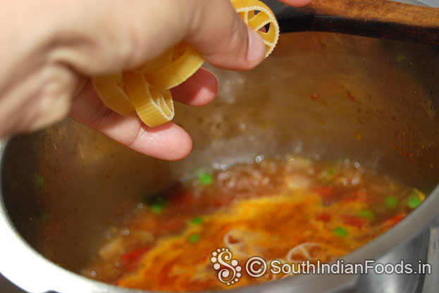 Heat pressure cooker with oil then add onion garlic